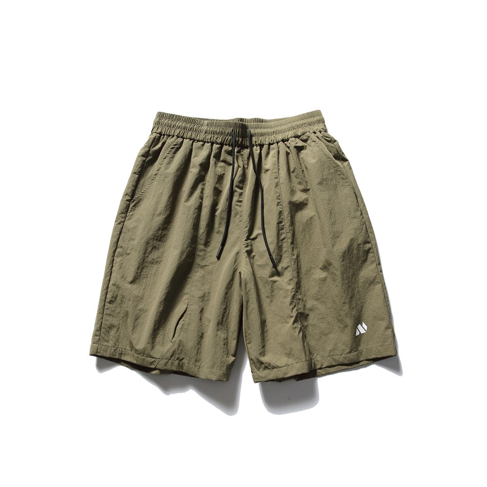 Khaki olive knee-length drawstring shorts with elastic waist and small white logo, flat front view