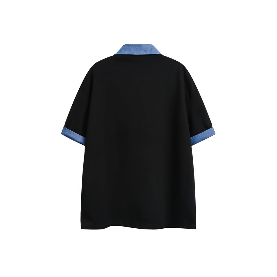 Back view of a black short-sleeve top with a blue collar and blue sleeve cuffs, shown flat against white.