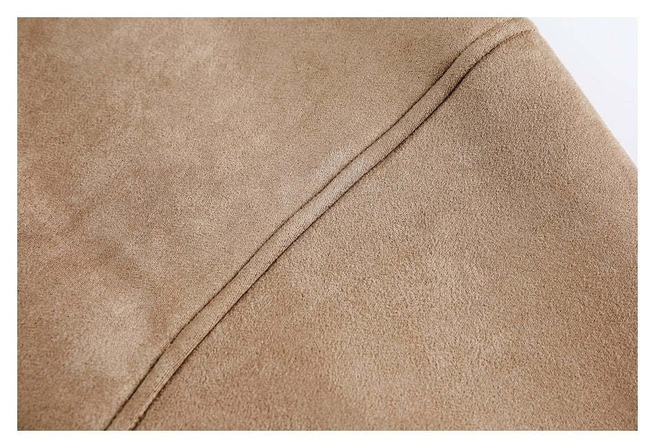 Close-up showing the tan jacket's fine surface texture and curved stitched seam.