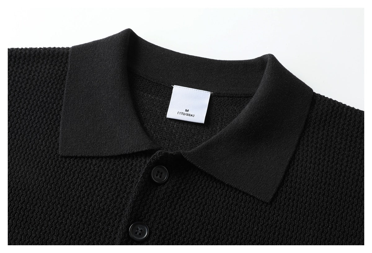 Close-up of the black polo's collar, two buttons, textured knit, and size label marked M (170/88A).