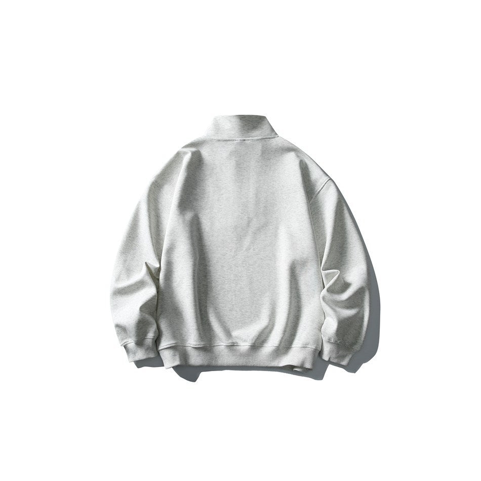 Back view of a light gray heather quarter-zip sweatshirt with a high collar and ribbed cuffs and hem.