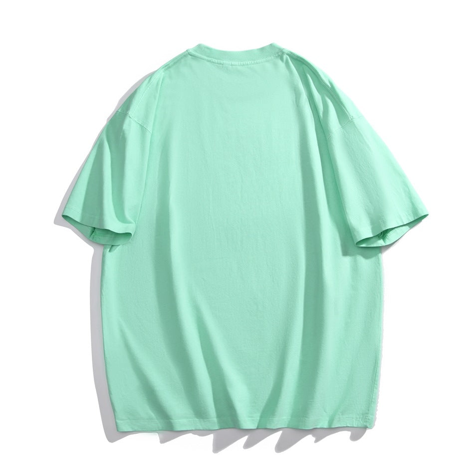 Back view of a plain oversized mint-green T-shirt with short sleeves.