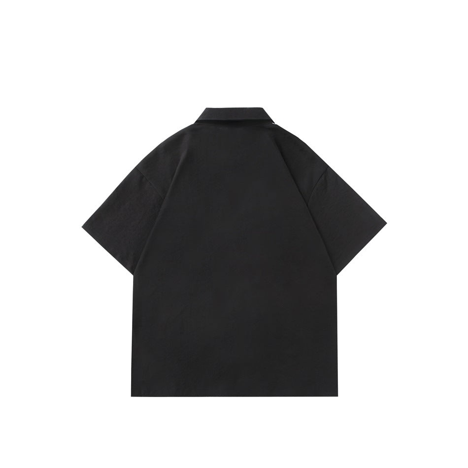 Back view of a black short-sleeve collared shirt with a straight hem.