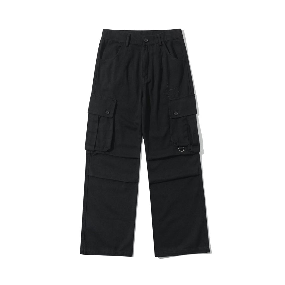 Black straight-leg cargo pants flat lay front view with button-flap thigh pockets and D-ring strap detail
