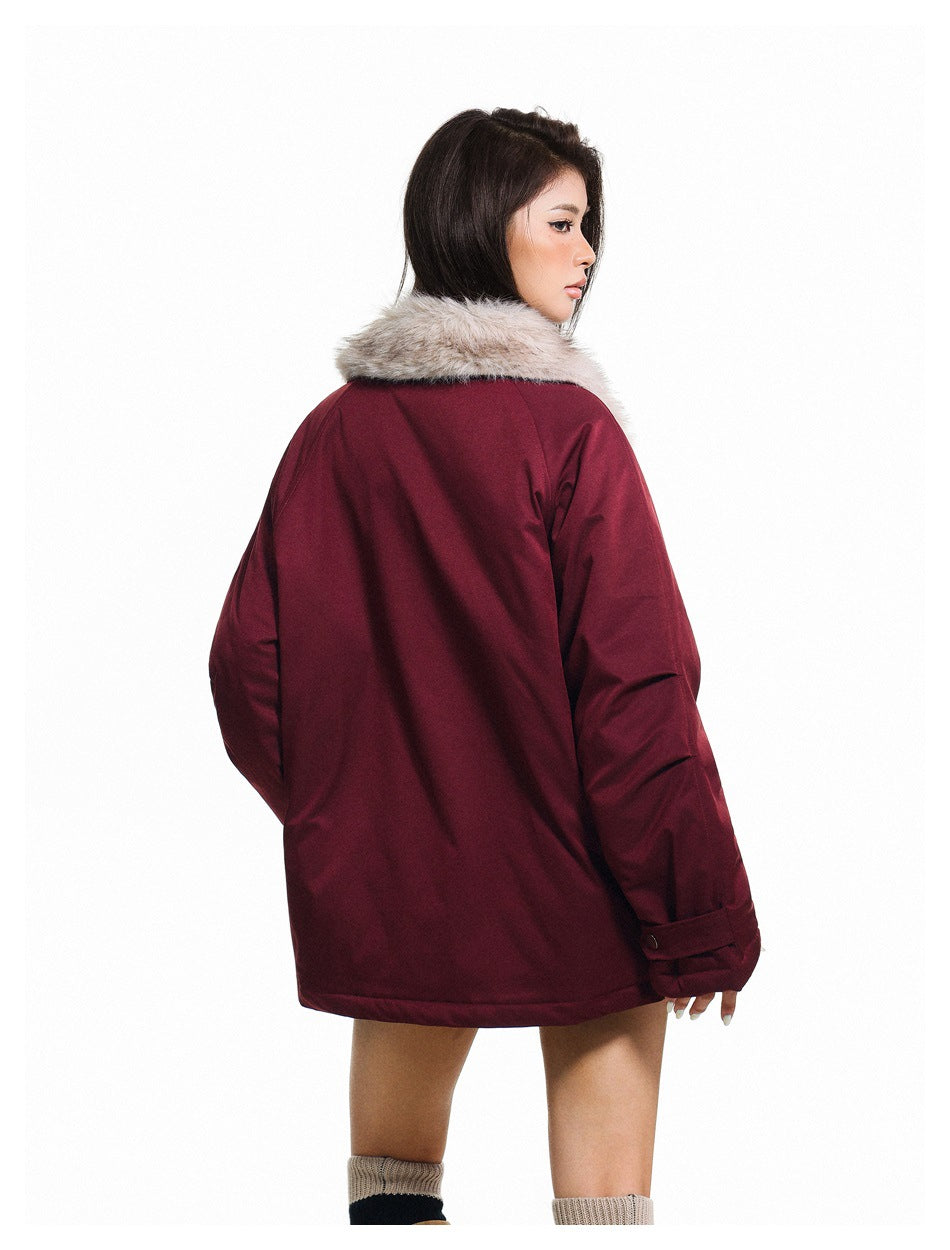 Model shown from behind wearing a burgundy jacket with a pale gray fur collar and cuff tabs.