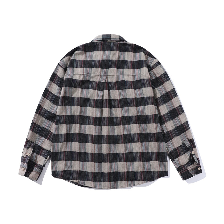 Back view of black, charcoal and taupe plaid long-sleeve shirt with back yoke and center pleat, flat lay