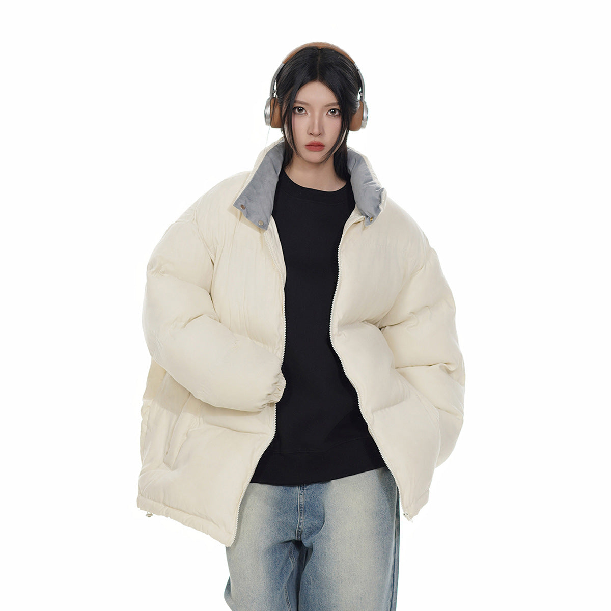 Model wearing an open ivory puffer jacket with a gray-lined collar, shown from the front.