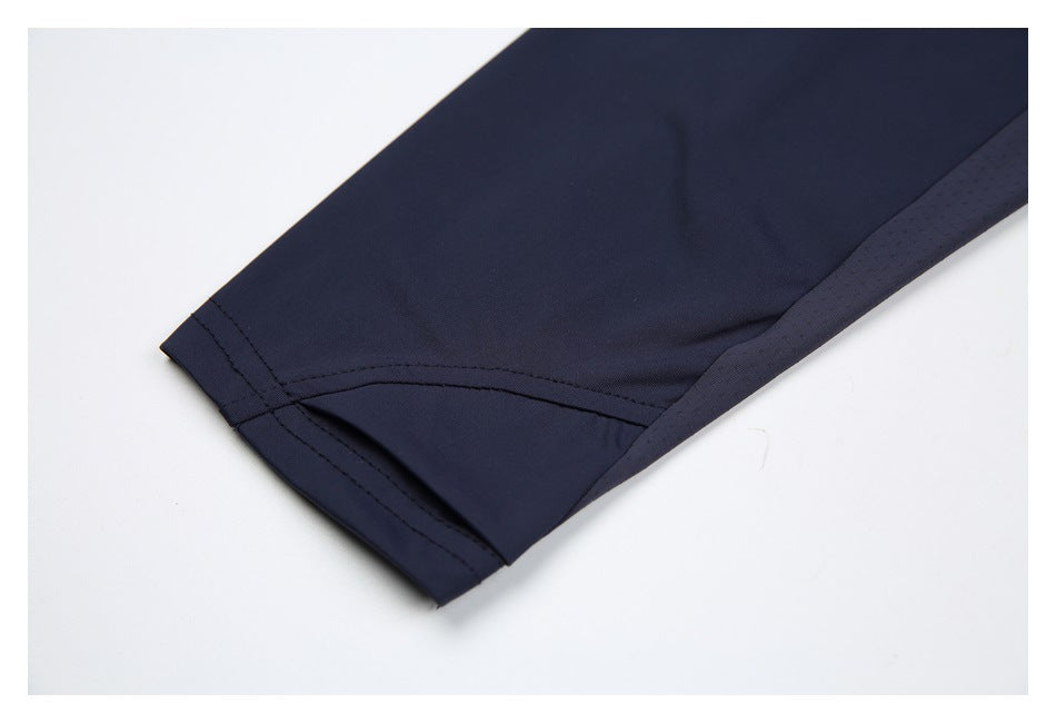 Close-up of the navy sleeve cuff with stitched hem and a contrasting side panel.