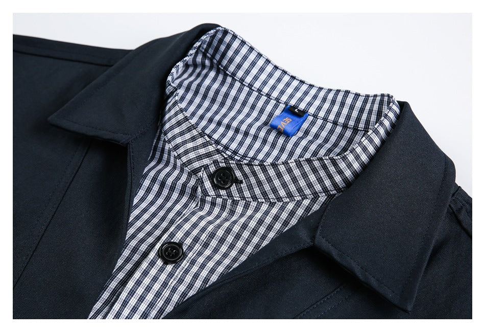Close-up of a navy jacket lapel and black-and-white checked collar and button placket.