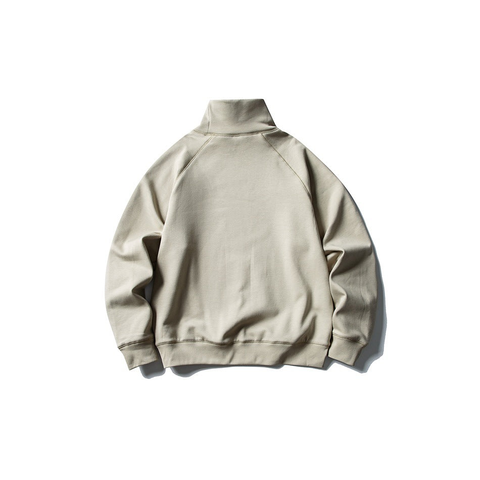 Back view of a light beige high-neck sweatshirt with raglan sleeves, ribbed cuffs and hem.