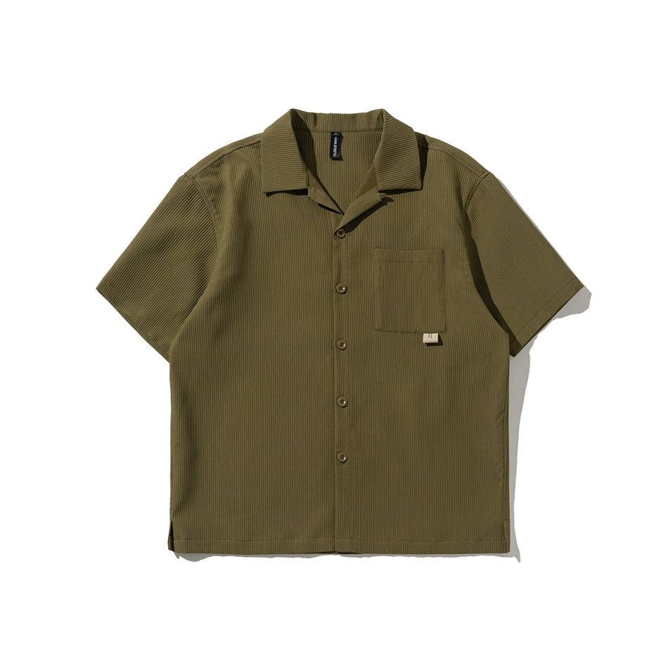 Olive green short-sleeve ribbed camp-collar shirt with button front and chest pocket, flat lay front view