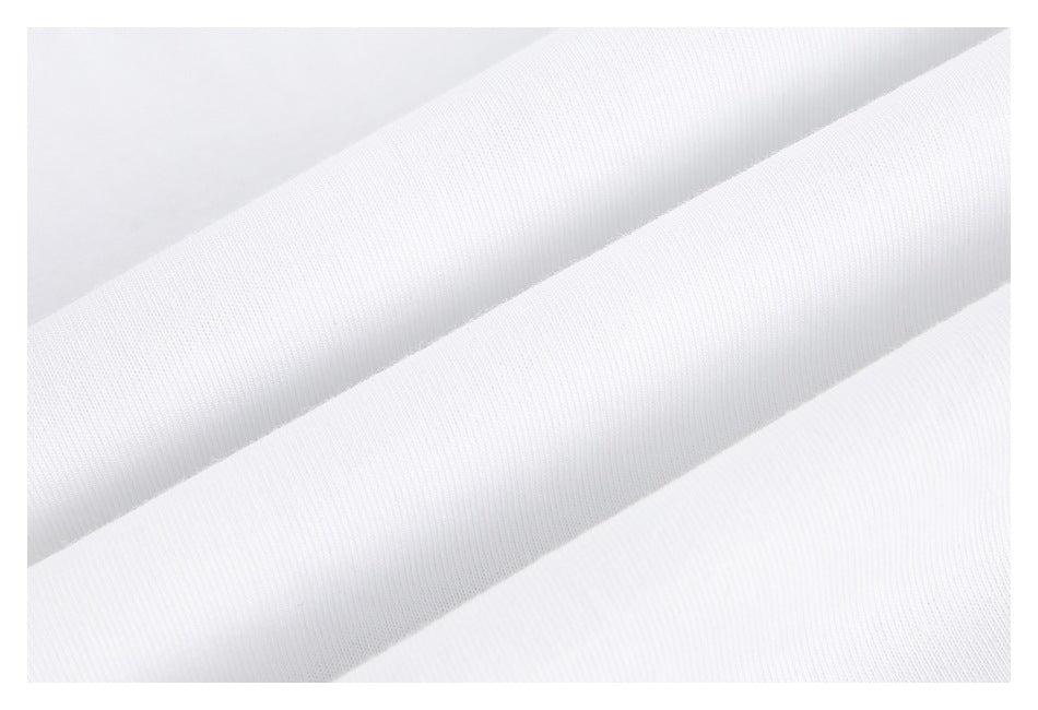Close-up of plain white fabric arranged in soft diagonal folds.