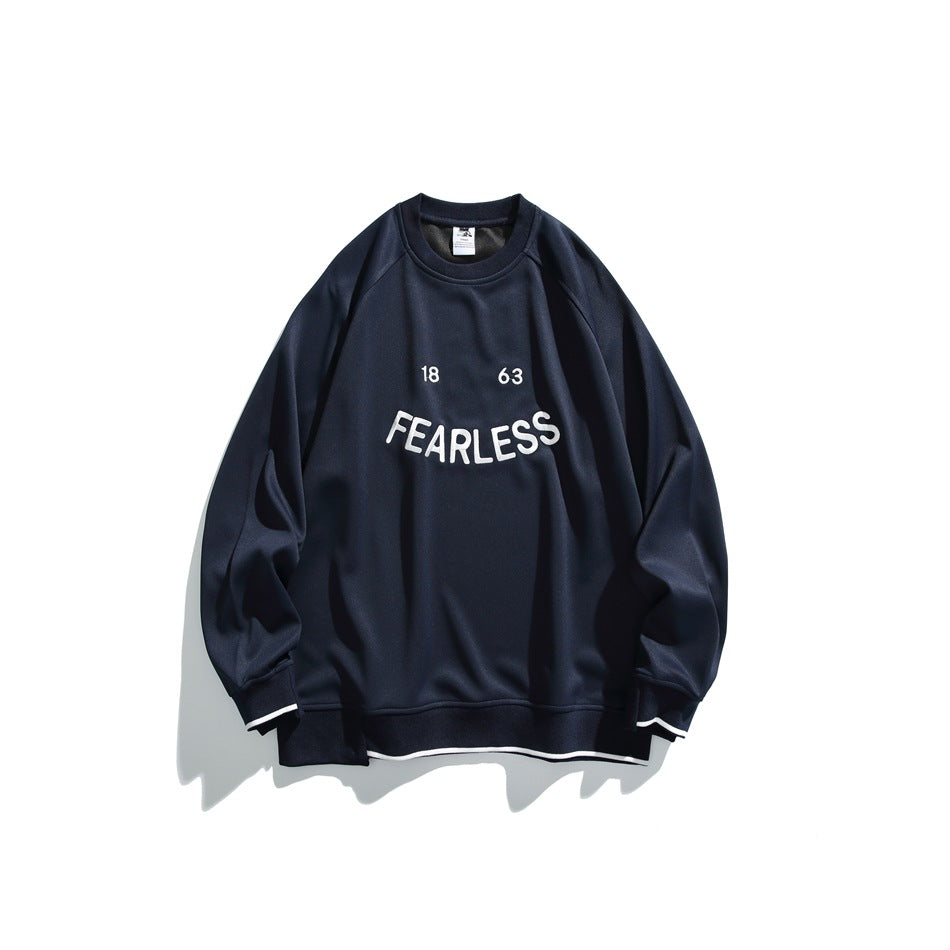 Navy blue crew-neck sweatshirt with white FEARLESS 18 63 chest lettering and white stripe trim at the cuffs and hem