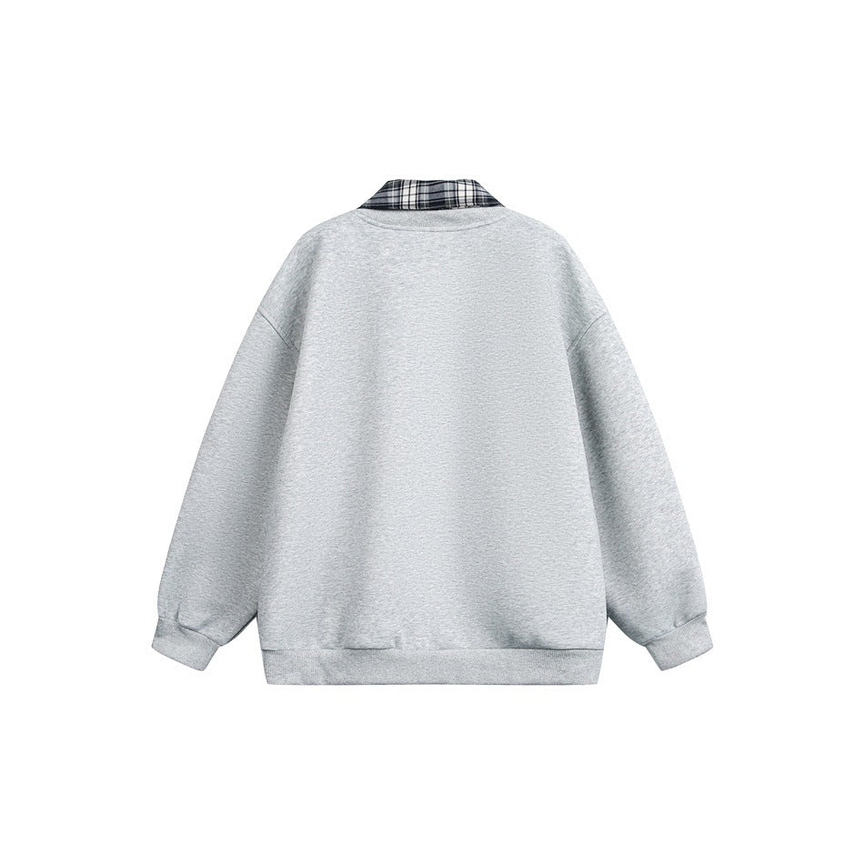 Back view of a light gray snap-front jacket with a black-and-white plaid collar.