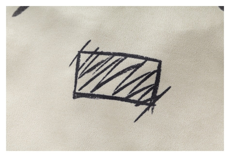 Close-up of a black sketch-like rectangular graphic printed on ivory fabric.