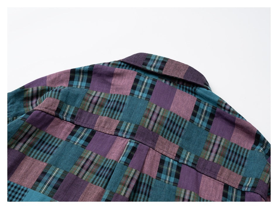 Close view of the back yoke and collar of a teal, purple, and dusty-pink patchwork plaid shirt.