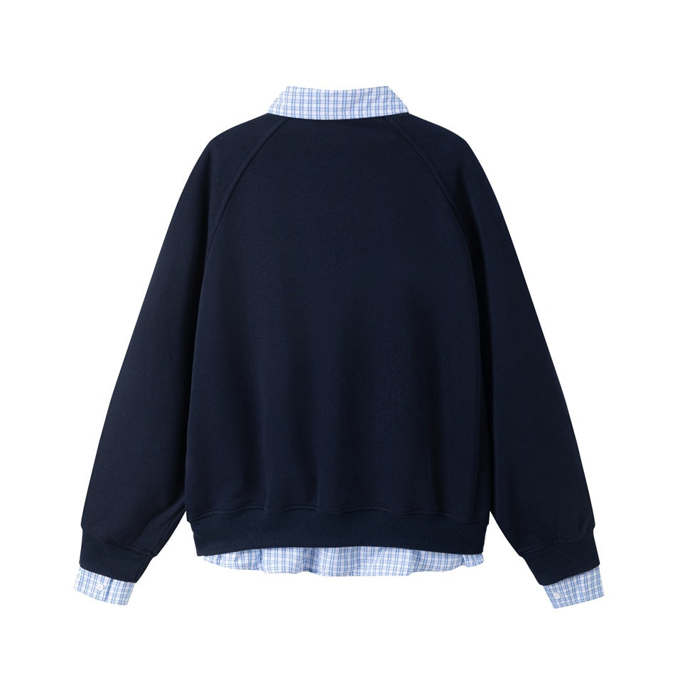 Back view of a navy sweatshirt with raglan sleeves, ribbed cuffs and hem, and blue checked shirt details at the collar