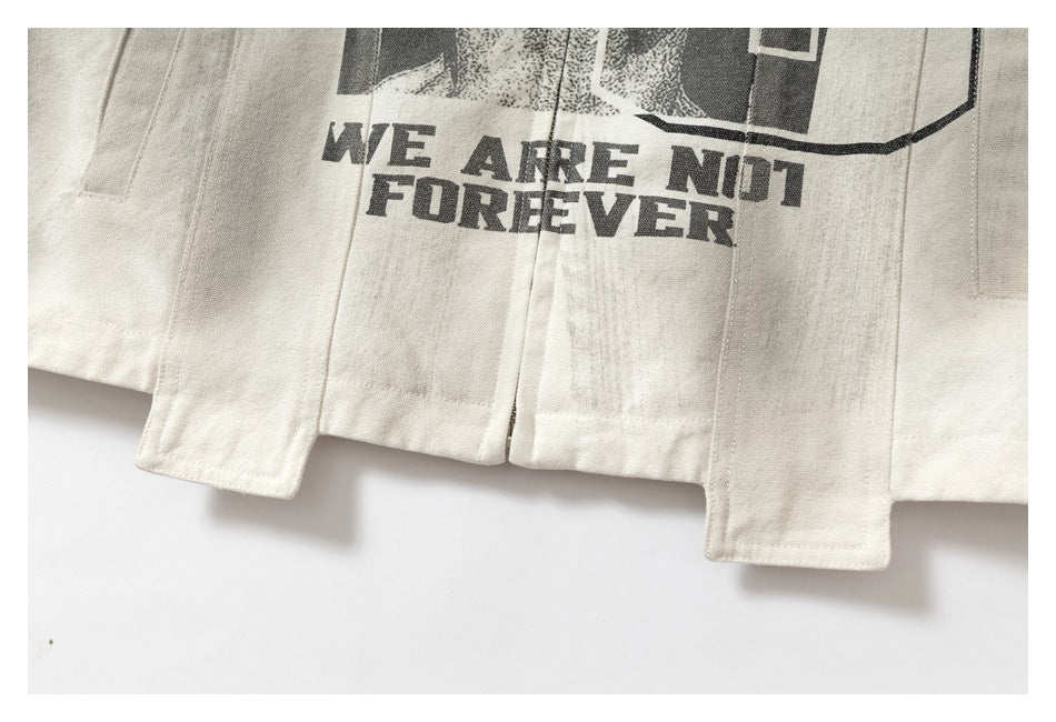 Close-up of the off-white jacket hem with a center opening, long panels, and the printed words “WE ARE NOT FOREVER.”