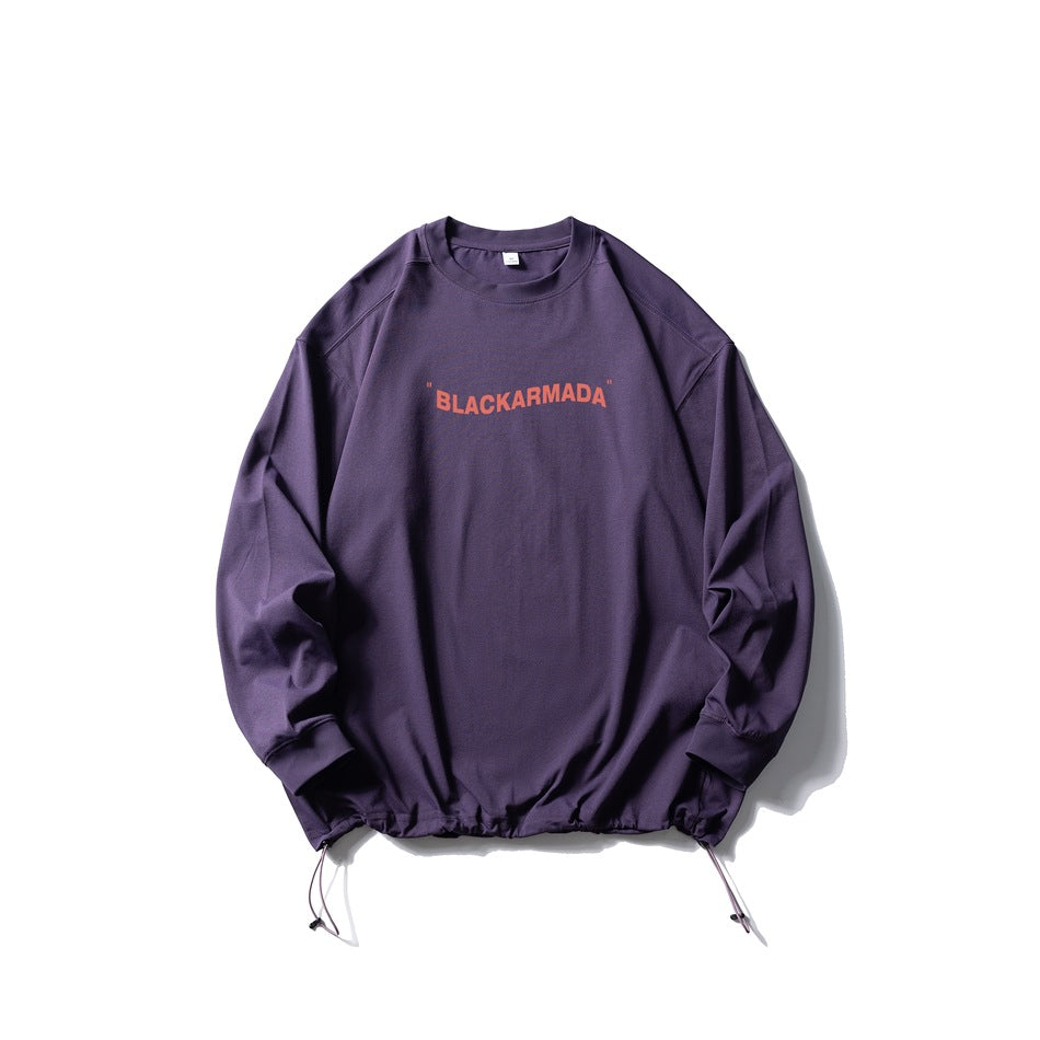 Purple long-sleeve crew-neck top with coral chest text print and drawstring hem, flat lay