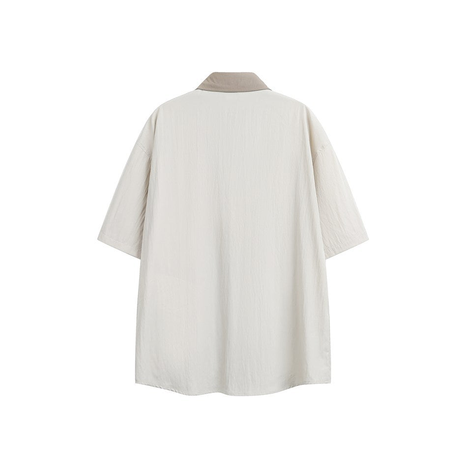 Back view of sand short-sleeve shirt with taupe collar and lightly crinkled plain back