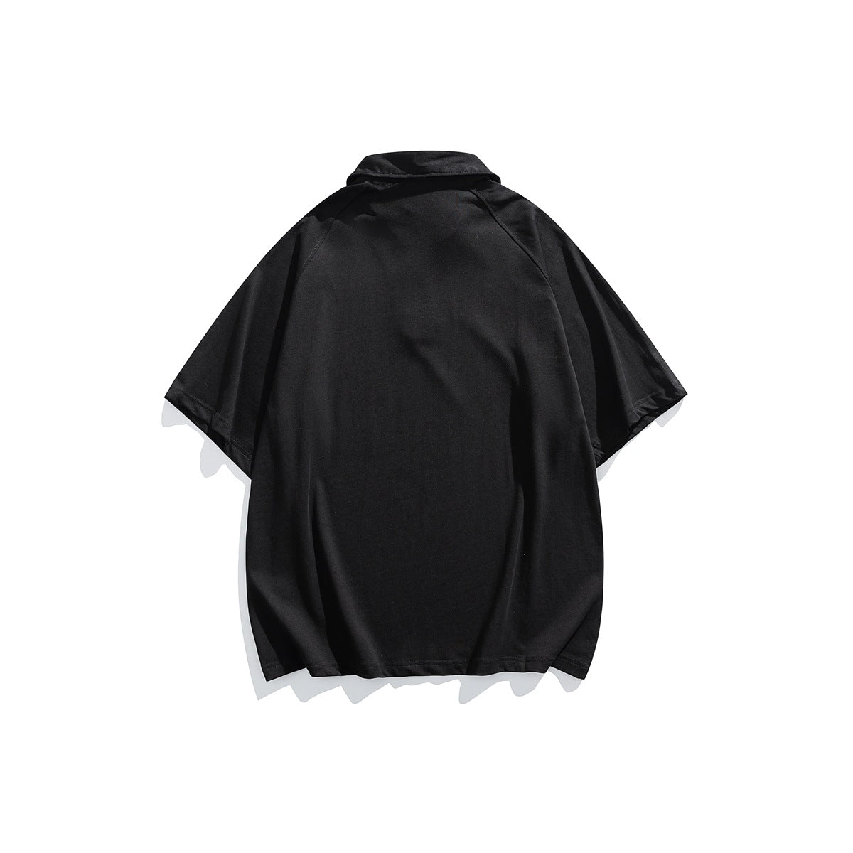 Back view of a plain black short-sleeve collared top with raglan seams.