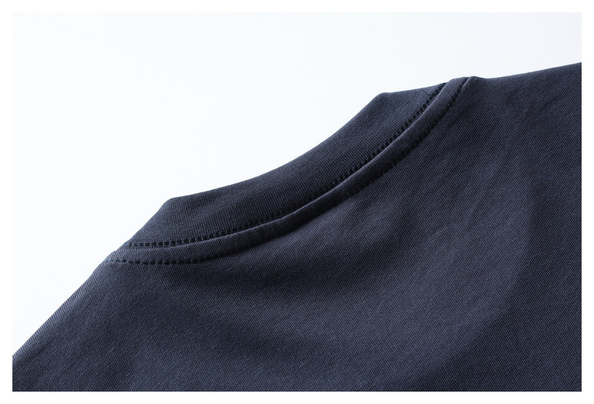 Close-up of the dark navy garment's round neckline and stitching.