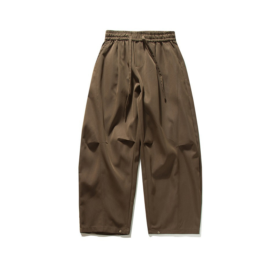 Coffee brown wide-leg drawstring pants, flat front view with knee folds and hem snaps