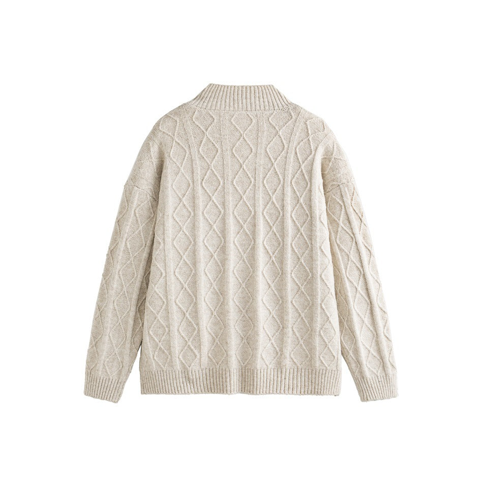Back of an oatmeal knit cardigan with raised diamond patterns and ribbed collar, cuffs, and hem, shown flat.