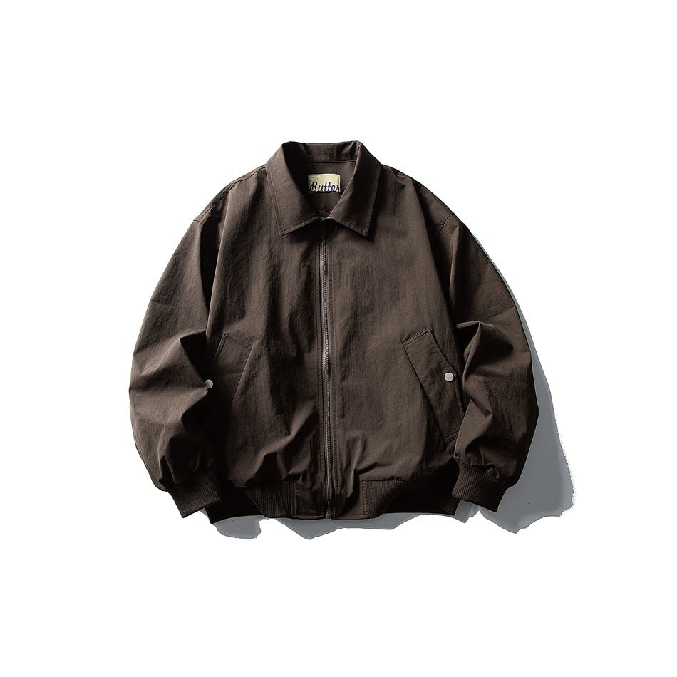 Coffee brown zip-front jacket with turn-down collar, slanted pockets and ribbed cuffs and hem, flat lay front view