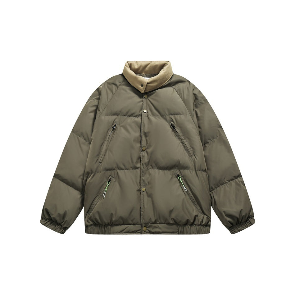Army green puffer jacket with tan stand collar, snap front, four zip pockets and elastic hem, flat lay front view