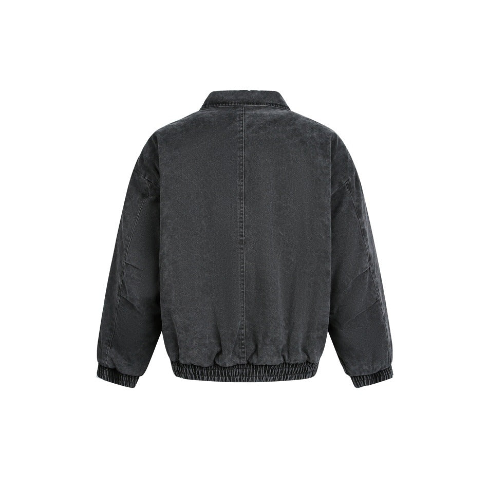 Back view of a charcoal washed jacket with a center seam, wide sleeves, and elastic cuffs and hem on a white background.