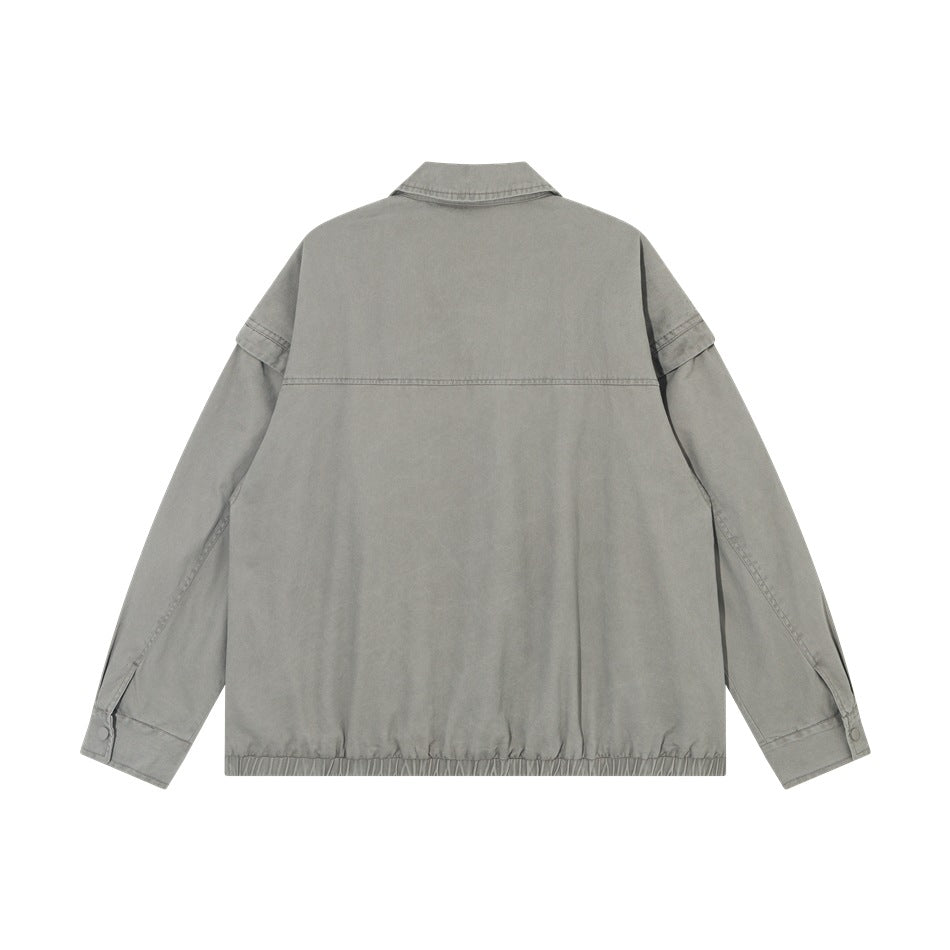 Back view of gray zip jacket flat lay showing upper back seam, snap cuffs and elastic hem
