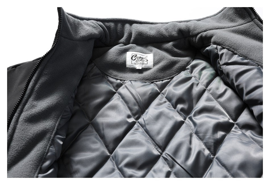 Open jacket interior showing gray diamond-quilted lining, fleece trim, and a sewn neck label.