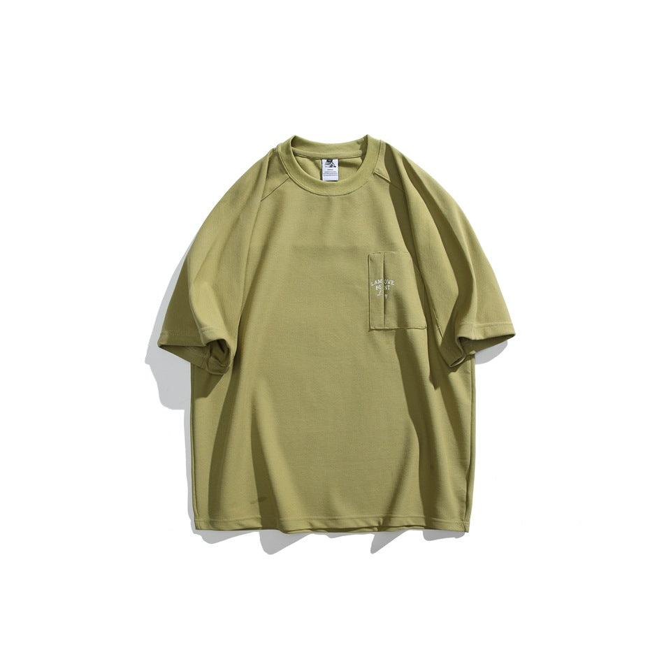Avocado green short-sleeve crew-neck T-shirt flat lay with chest patch pocket and small embroidered text