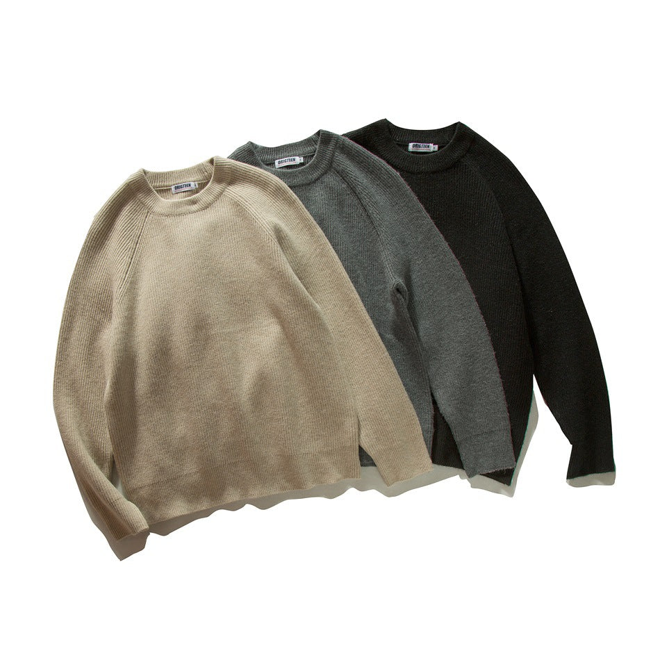 Three crew-neck raglan sweaters arranged together in beige, gray, and black.