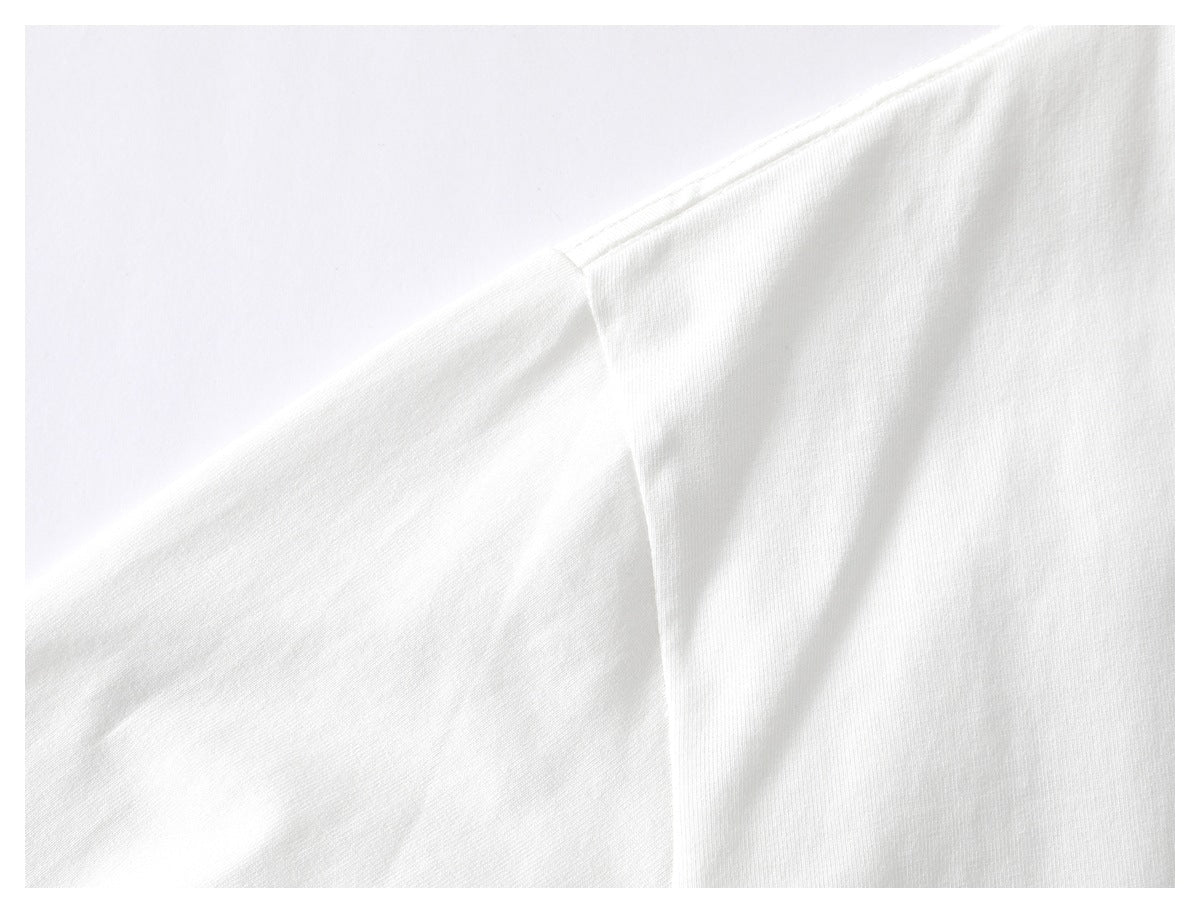 Close-up of the shoulder seam on a white shirt.