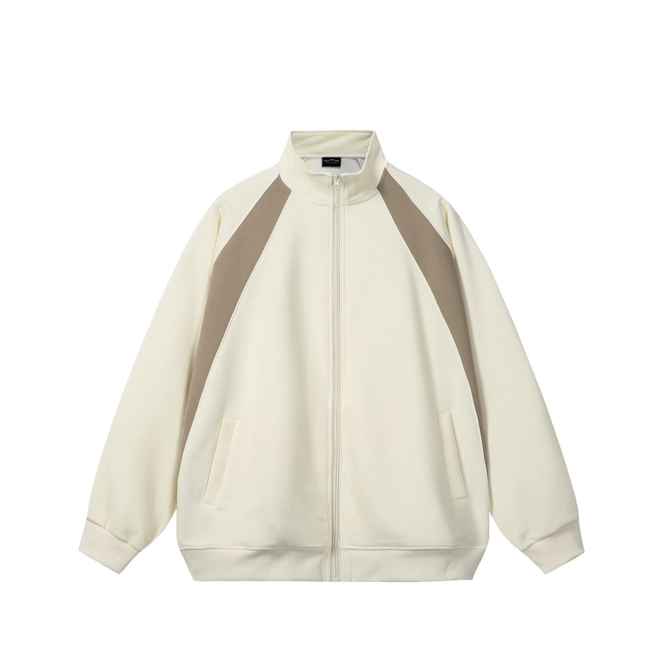 Cream jacket with taupe raglan panels, stand collar, front zipper, slit pockets and ribbed cuffs, flat front view