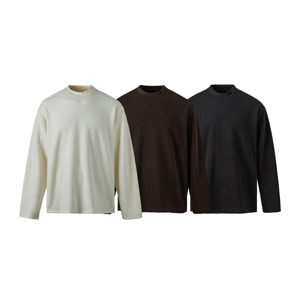 Three long-sleeved crew-neck shirts shown from the front in ivory, dark brown, and charcoal.