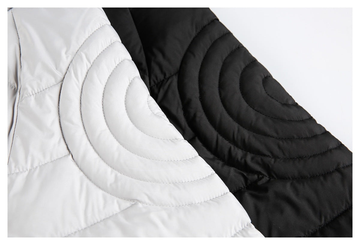 Close-up of curved quilted sleeve panels on light gray and black puffer jackets.