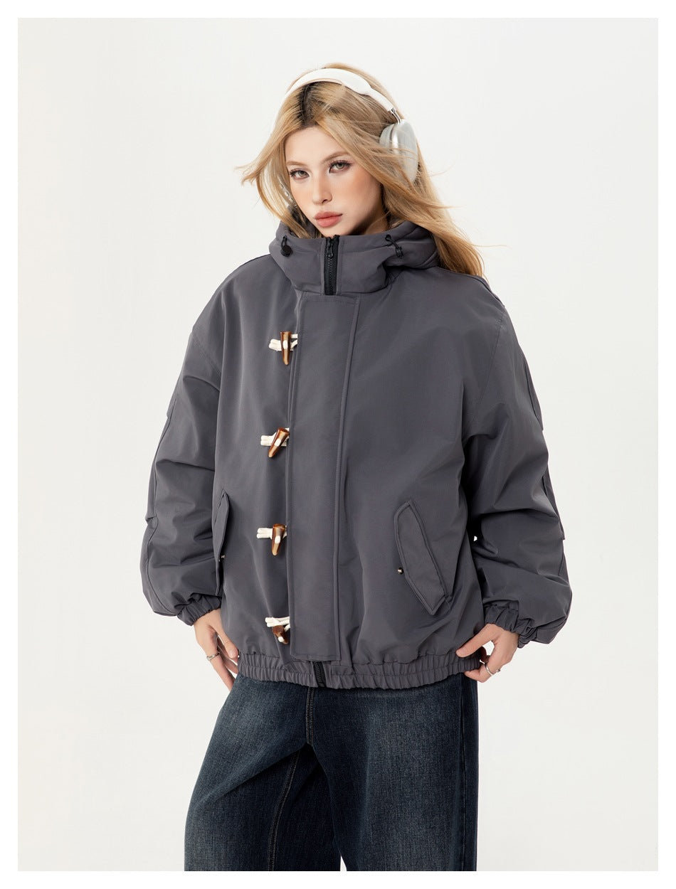 Model wearing a charcoal gray hooded jacket with four toggle closures, angled pockets and an elastic hem.