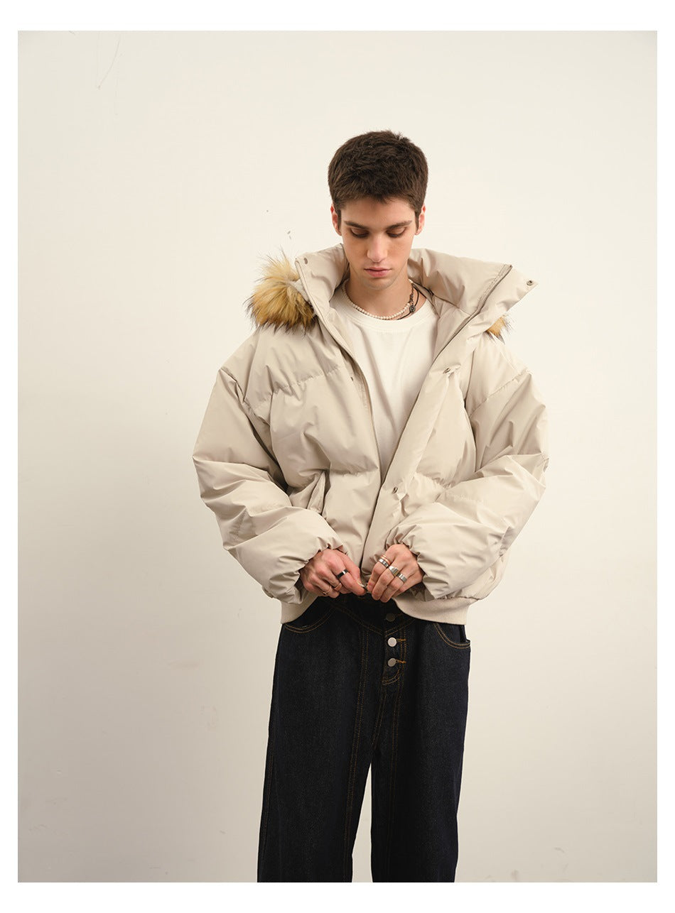 Model wearing a light beige puffer jacket with tan fur-trimmed hood, shown from the front with the jacket open.
