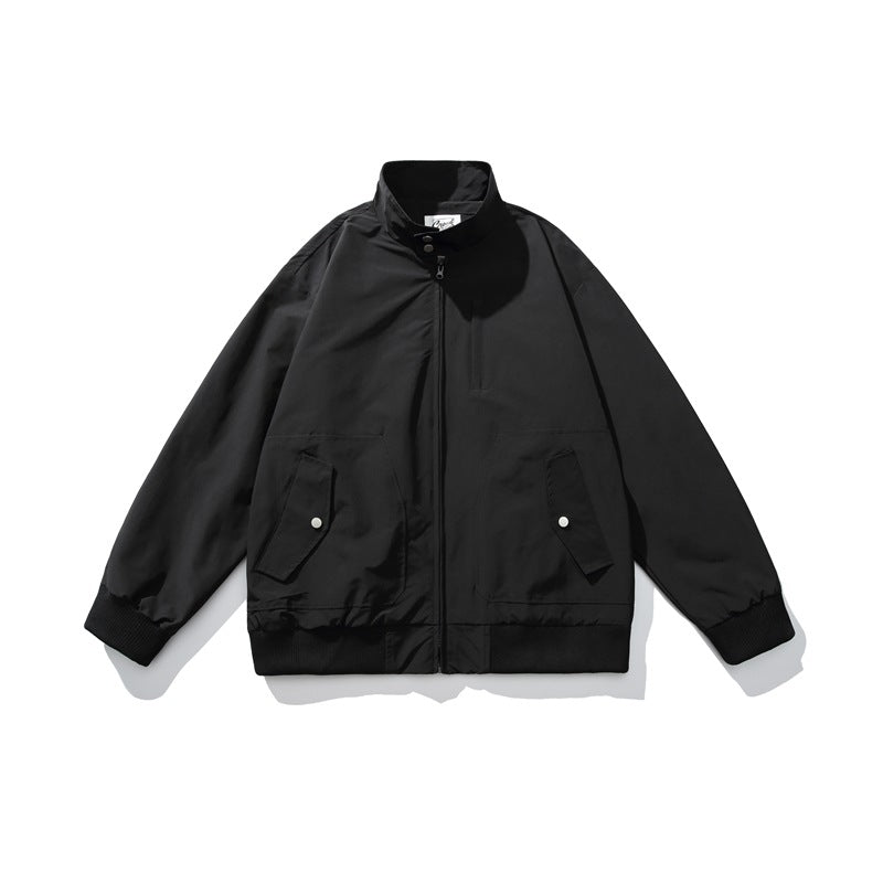 Black zip-up stand-collar jacket flat lay with snap flap pockets, chest pocket and ribbed trim