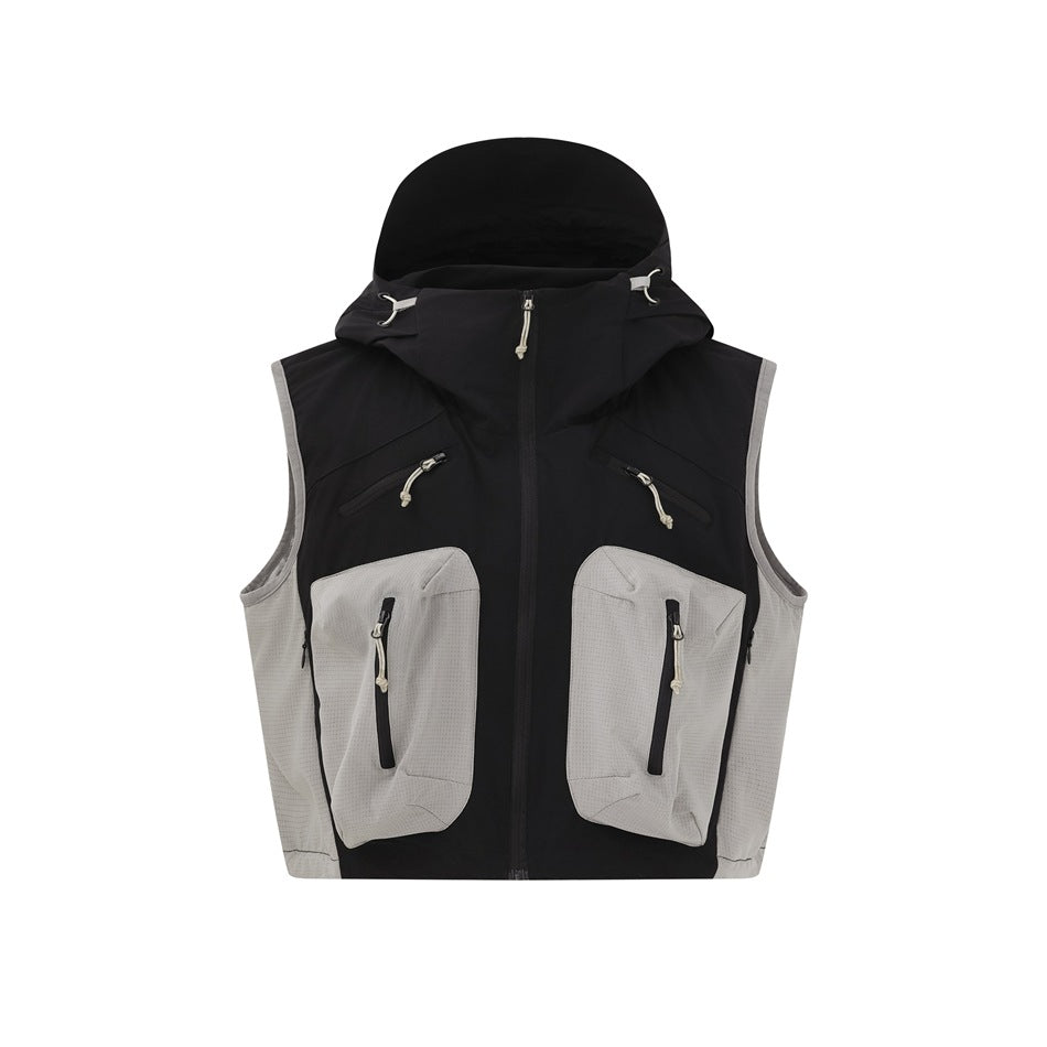 Black hooded utility vest with light gray side panels and two large zippered front pockets on a white background