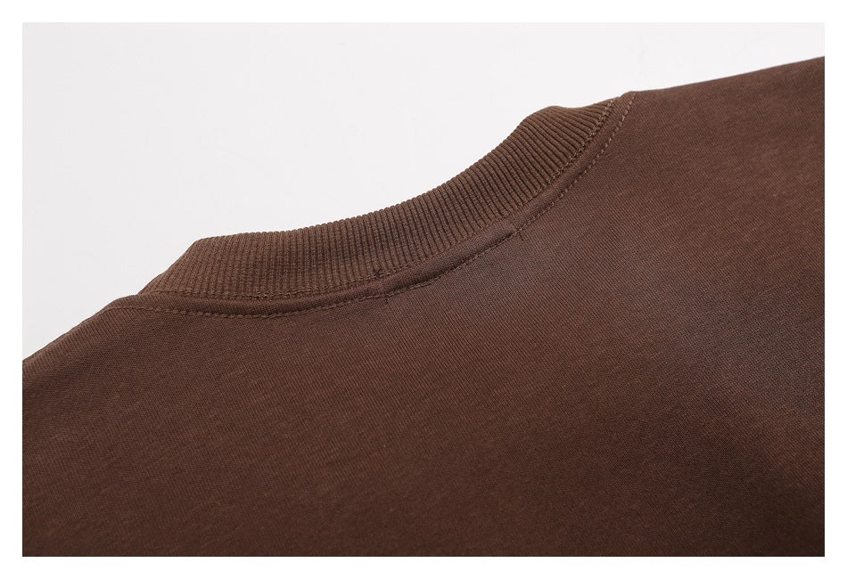 Close-up of the back neckline and ribbed collar of a brown garment.