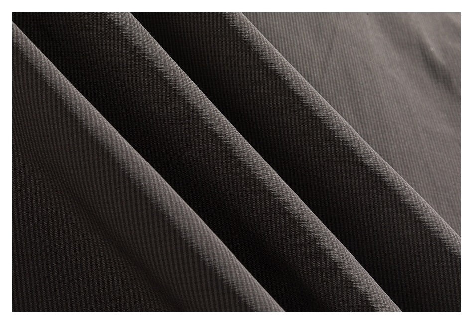 Macro view of dark gray fabric showing a fine, subtly ribbed texture.