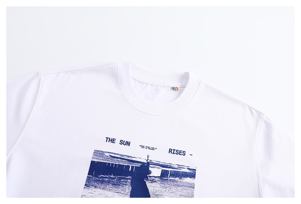 Cropped front view of a white crew-neck T-shirt with a navy photo-style chest print.