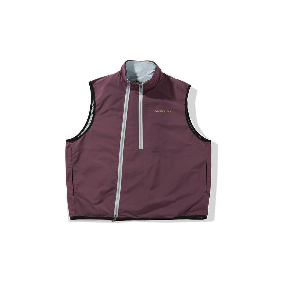 Front view of a plum sleeveless vest with a stand collar, asymmetric front zipper, short chest zipper, and black trim.