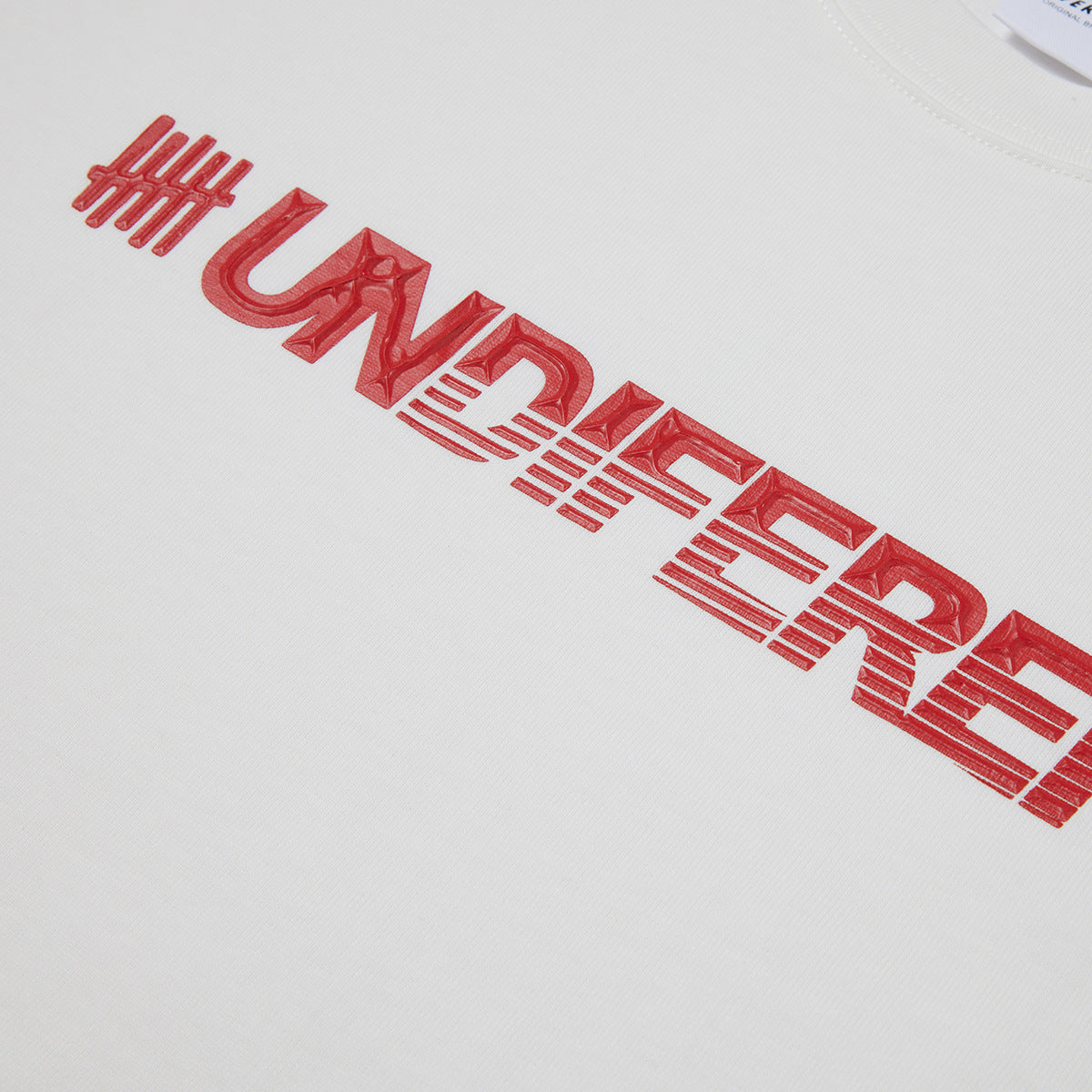 Close-up of a white T-shirt showing large red stylized lettering and tally marks.