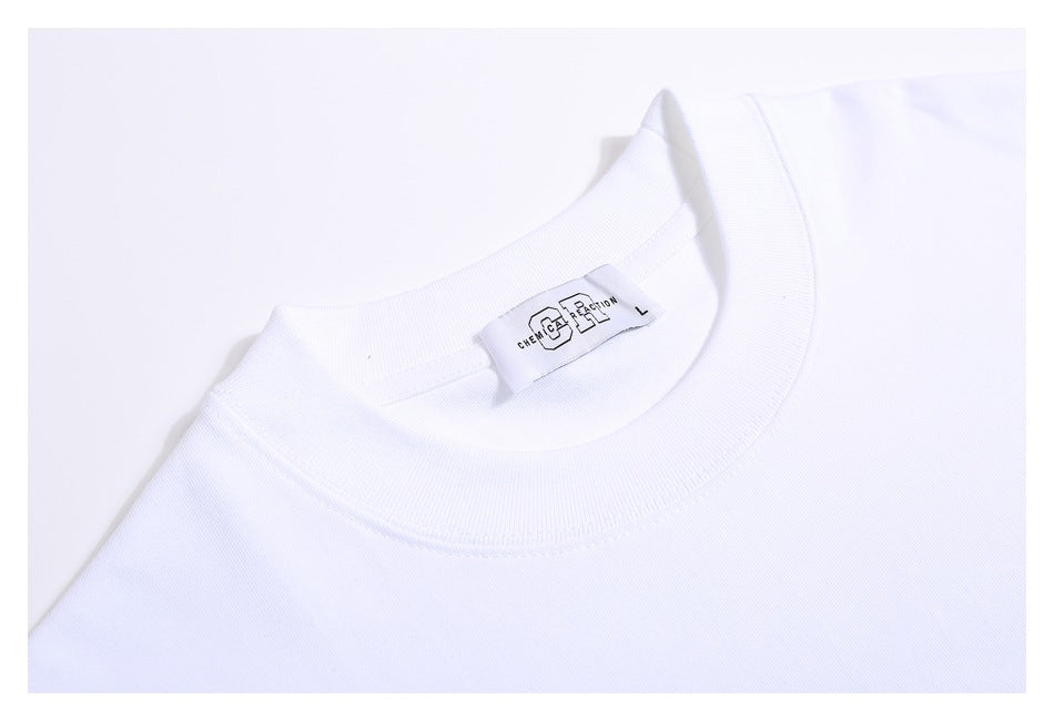 Close-up of the white T-shirt’s ribbed crew neck and sewn-in neck label.