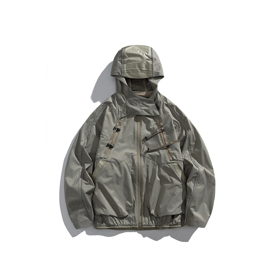 Sandstone khaki hooded zip jacket with chest straps, piped sleeve seams and large front pockets, flat lay